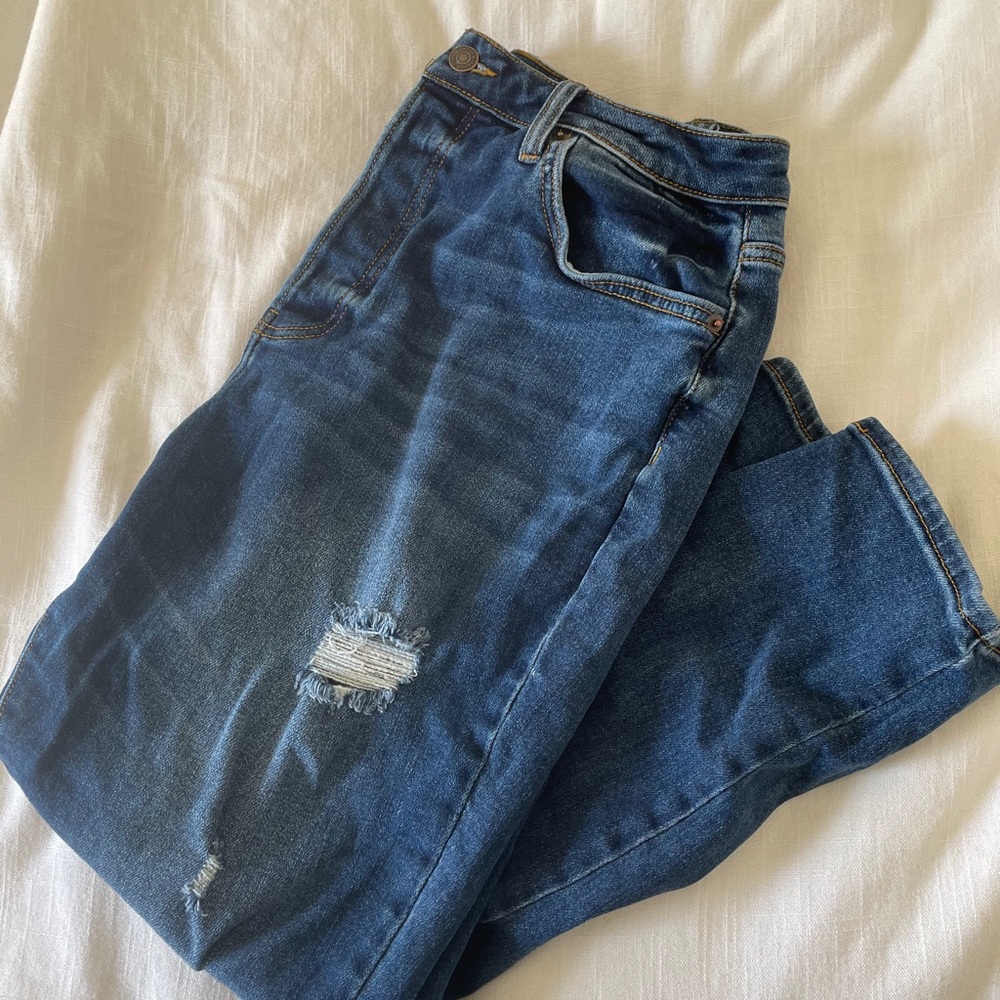 blue ripped jeans
